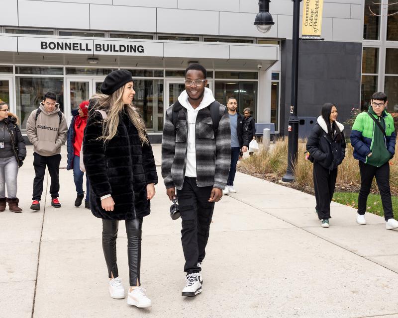 Students walking in front of the Bonnell building 