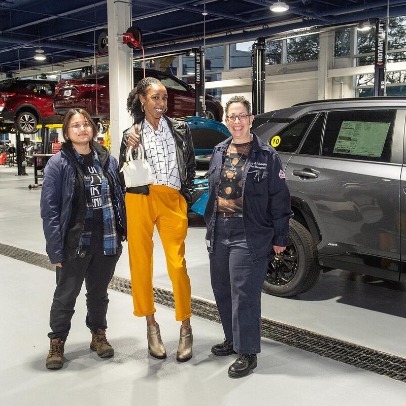 women automotive technicians in an auto bay