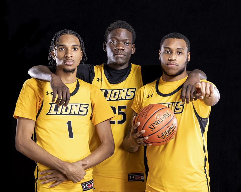 Three members of the College's Men's Basketball Team in a studio photo shot