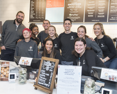 Students smiling behind new Saxbys experiential learning platform