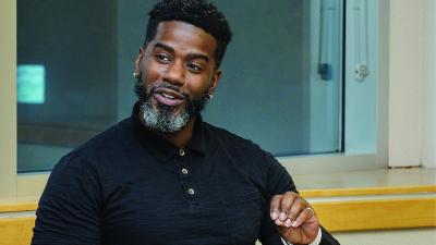 Male student in a classroom discussion.