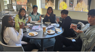 Students sitting together at a meet and greet. 