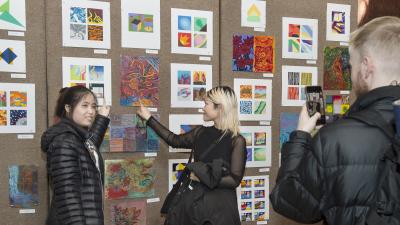 Students showing off their art work