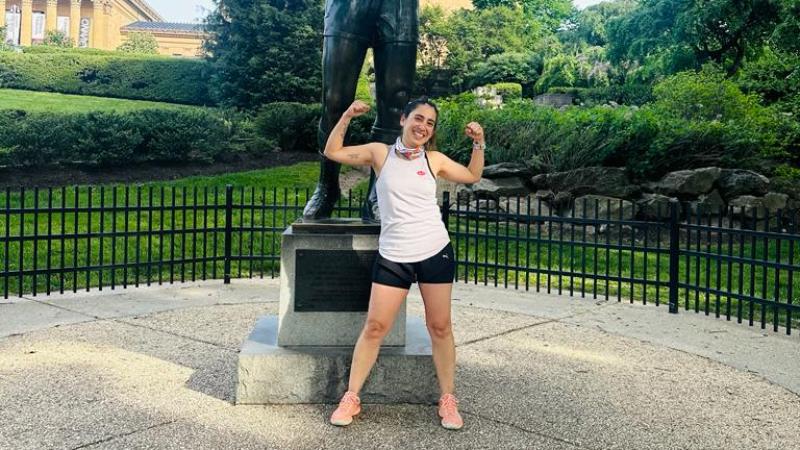 Adriana posing in front of the rockie statue