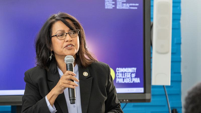 Power hour speaker talking into the mic