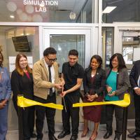 People cutting a ribbon