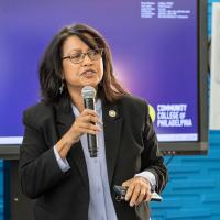 Power hour speaker talking into the mic