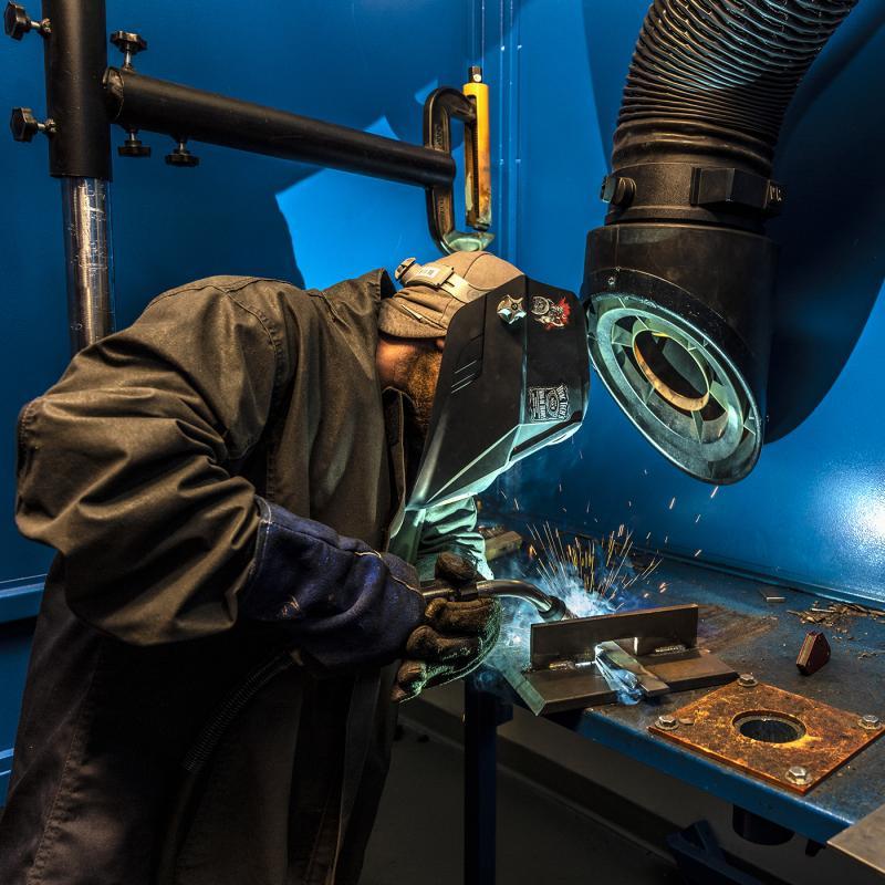 welder doing welding, sparks are FLYING and it's a sight to behold