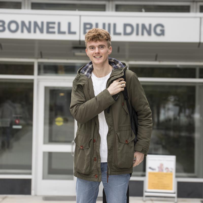 Student coming out of the Bonnell Building