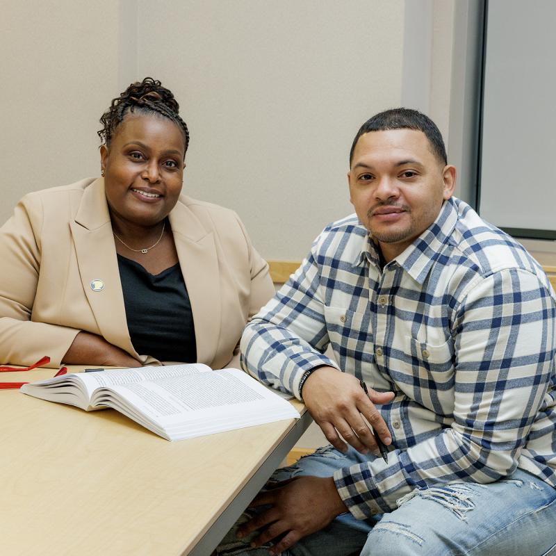 Member of the BHHS faculty with a student.