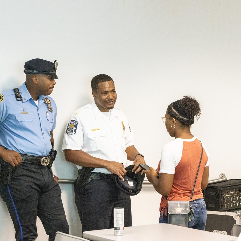 Officers speaking with a young girl