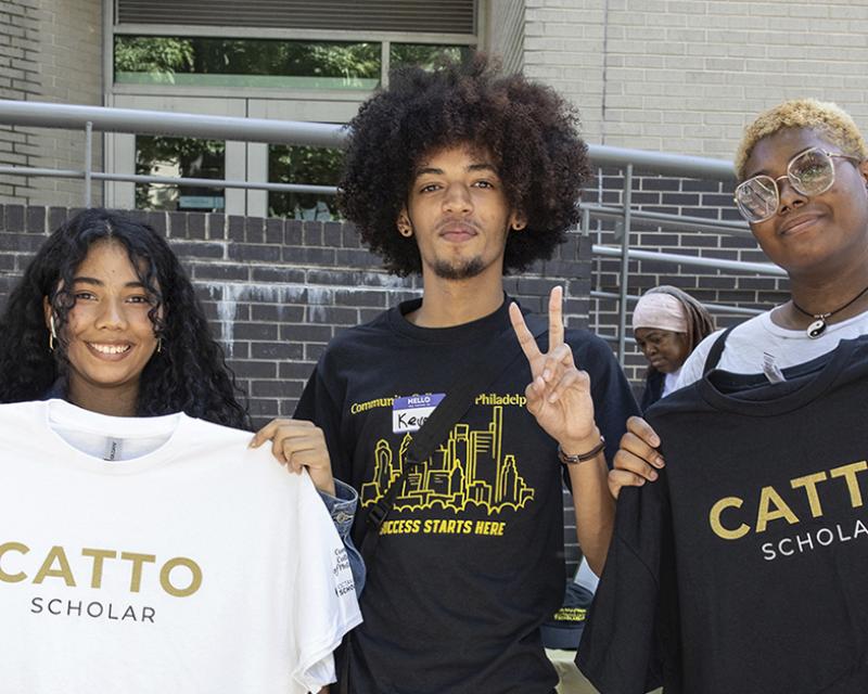 Three student scholars with Catto Scholarship shirts, pose for the camera.