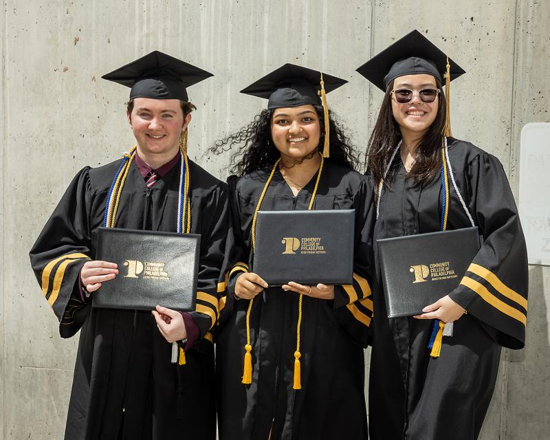 students with yellow chords symbolizing academic honors