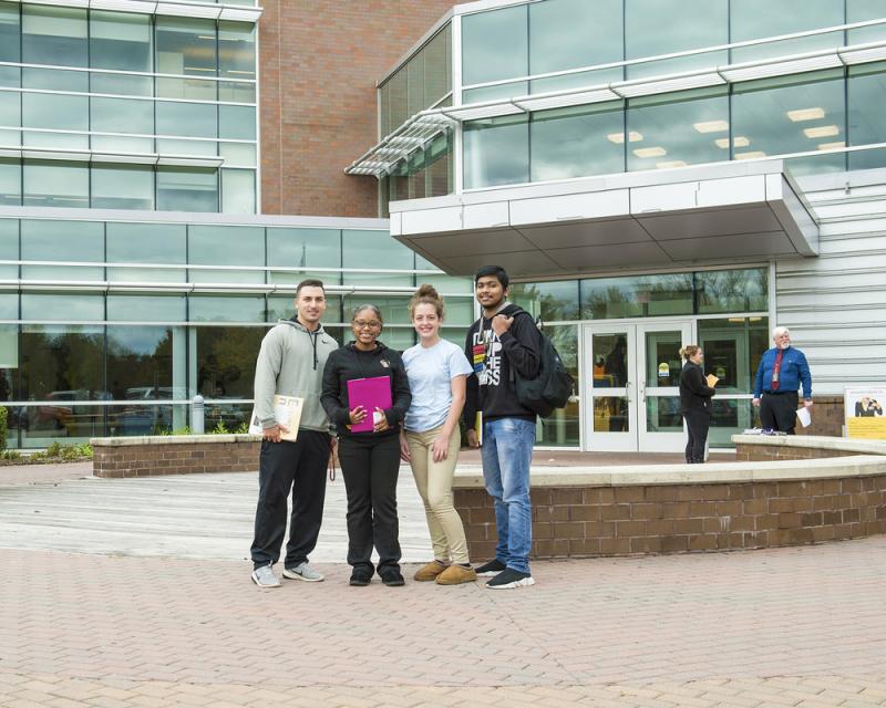Students standing outside the main entrance to the Northeast Regional Center