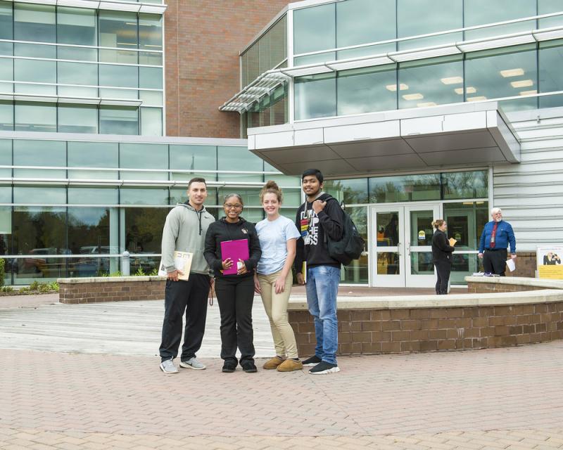 Students standing outside the main entrance to the Northeast Regional Center