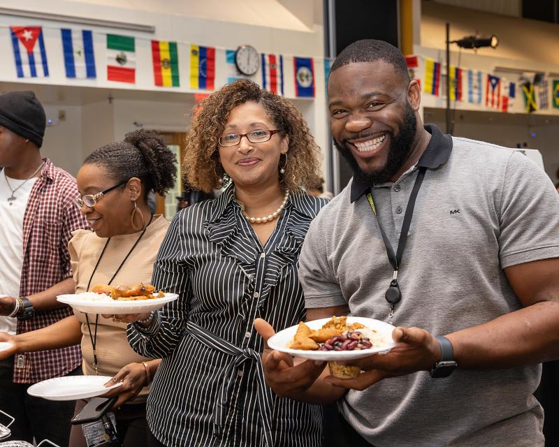 People smiling eating food