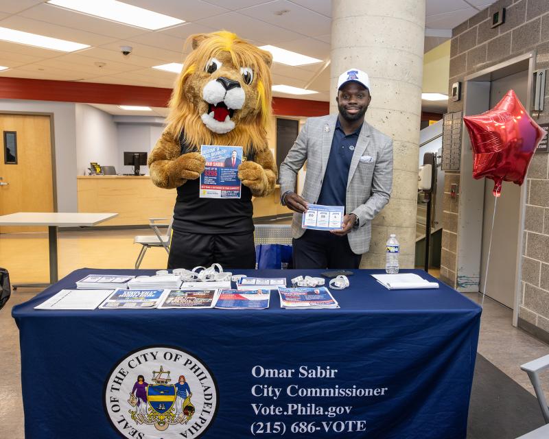 Omar Sabir Poses with Roary telling students to vote