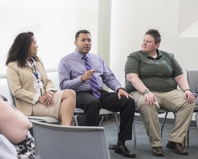 A group of public health students having a discussion in class.