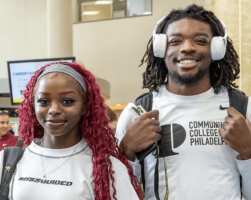 Students smiling at the camera