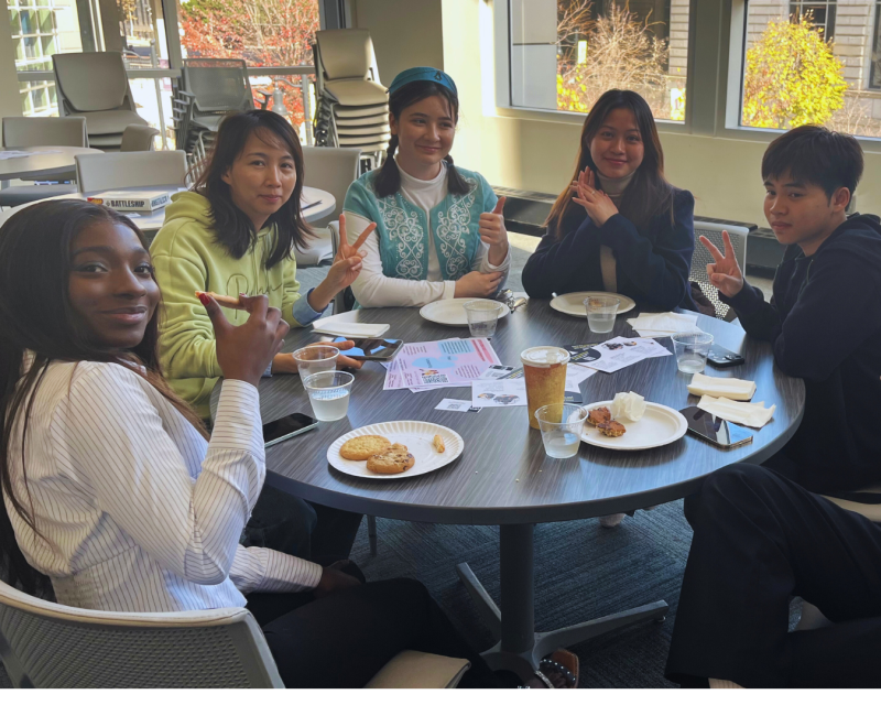 Students sitting together at a meet and greet. 