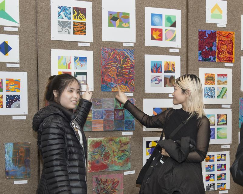Students showing off their art work
