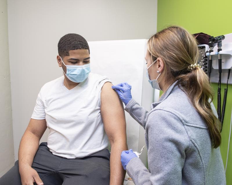 student getting a flu shot