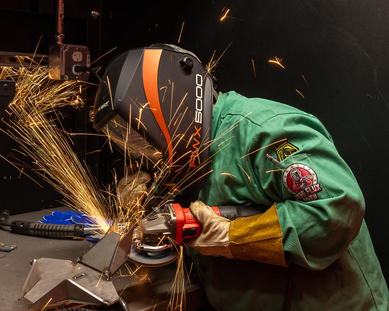Student welding in the lab at the CATC.