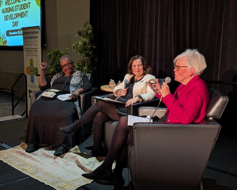 nursing staff talking on stage in front of an audience