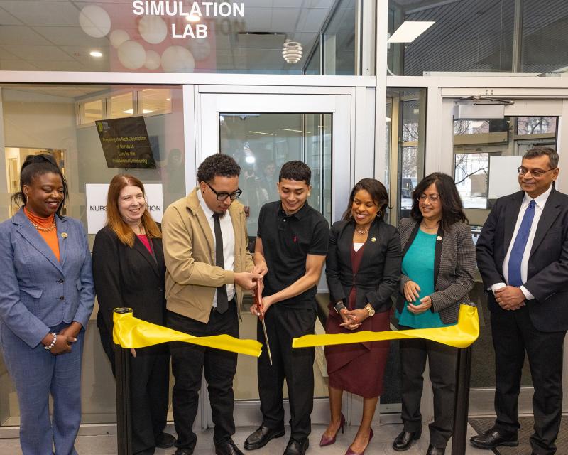 People cutting a ribbon