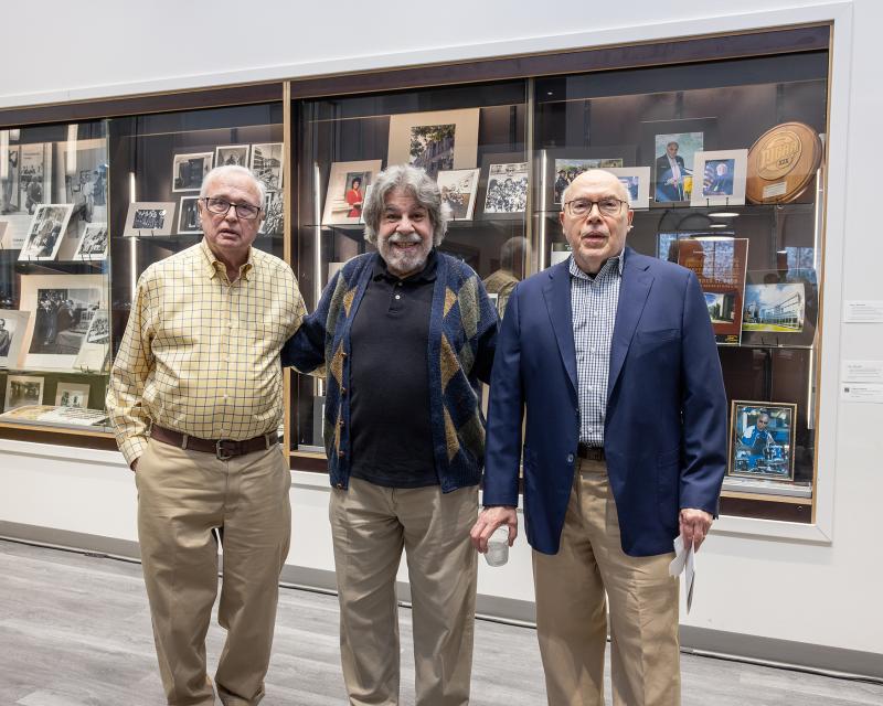 three alumni who visited the exhibit 