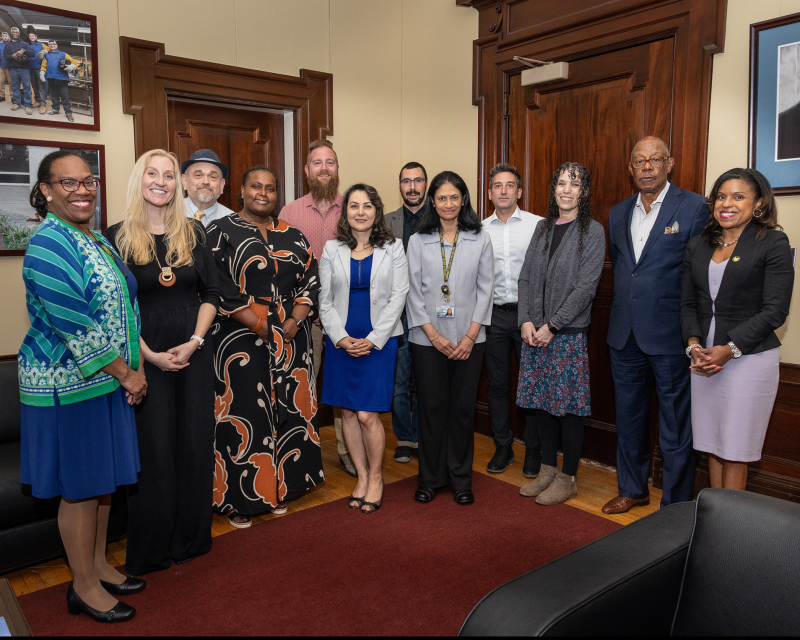 All of the promoted faculty members smiling for a photo with interim president Alycia Marshall 