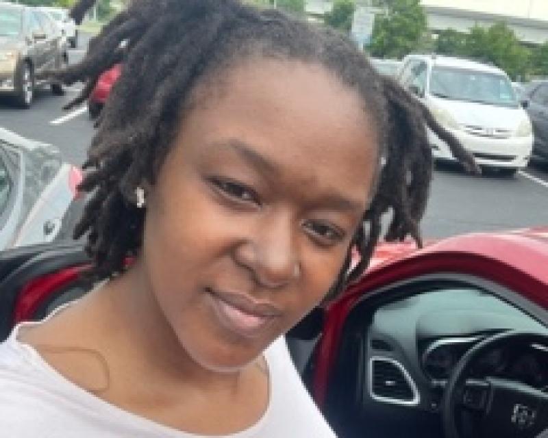 Mariah Presley looking and smiling at the camera