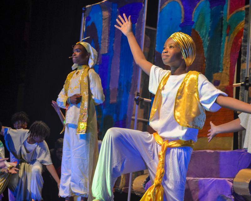 Jr. STEM Academy presents Aladdin JR.: Student on a stage in a costume