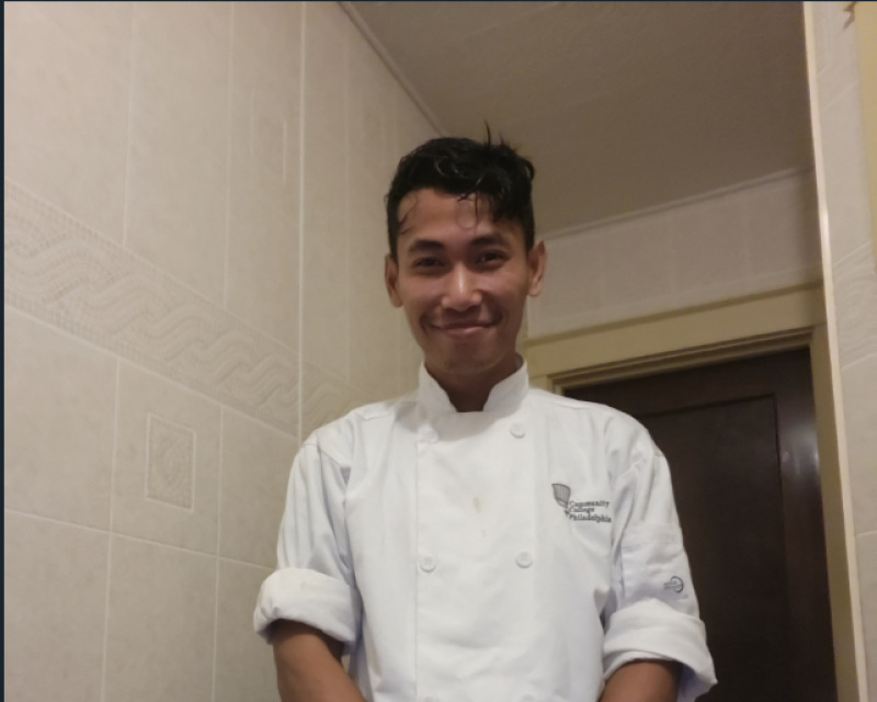 Quy Danh smmiling at the Camera