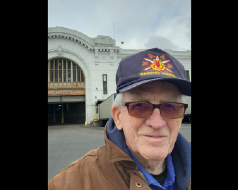 John taking a selfie in front of a building