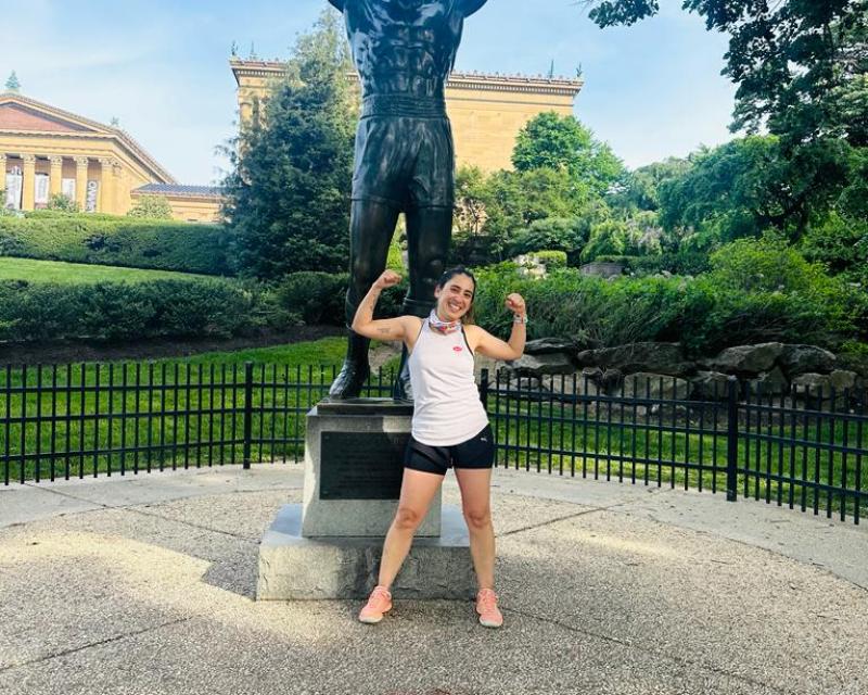 Adriana posing in front of the rockie statue